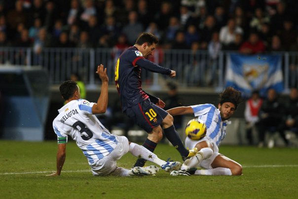Lionel Messi (10) åbnede scoringen, da FC Barcelona vandt i Malaga. Foto: JON NAZCA